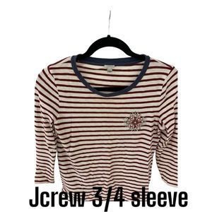 Stripped burgundy tee .  3/4 sleeve:  nice heeled design .  Great with denim.